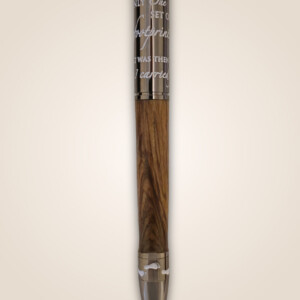 Wooden pen with faith scripture on the metal top.