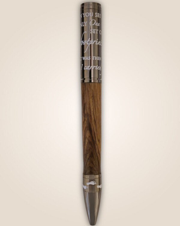 Wooden pen with faith scripture on the metal top.
